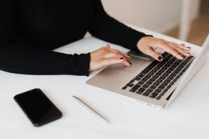 woman working on netbook in office