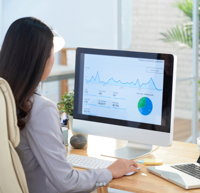 business woman sitting at desk in office