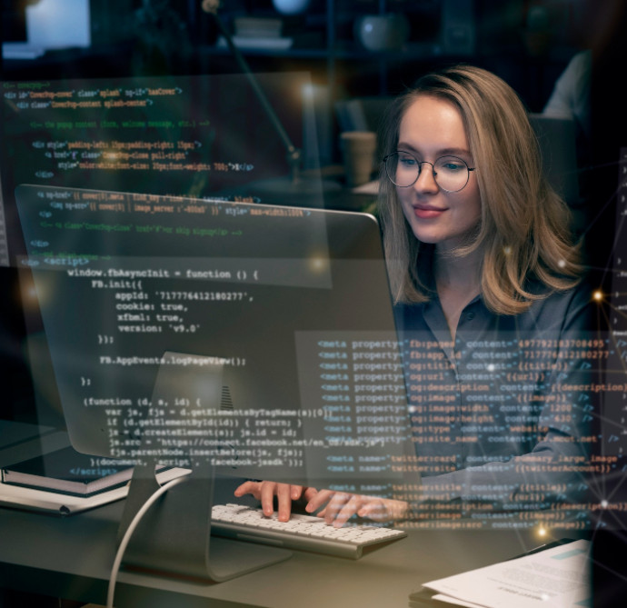 programmer woman sitting at desk in office